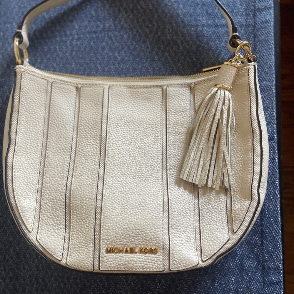 Michael Kors cream with tassel handbag